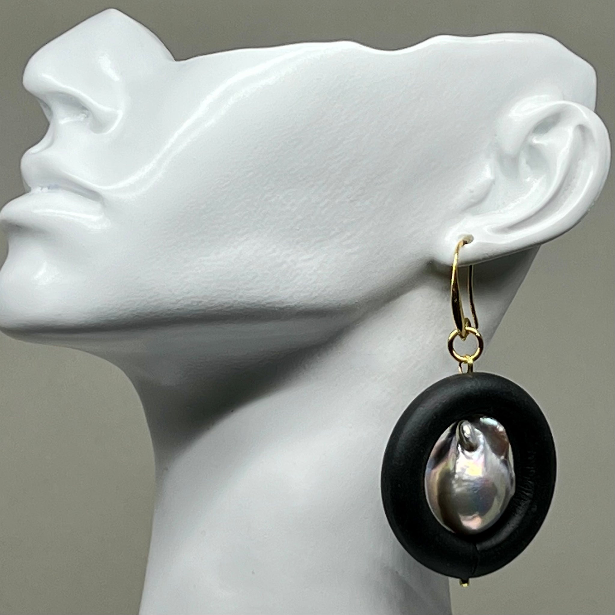 BLACK RUBBER EARRINGS WITH GENUINE BAROQUE PEARLS AND GOLD ENDCAPS. by nyet jewelry