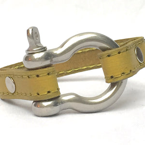 STITCHED LEATHER AND STAINLESS STEEL SHACKLE by nyet jewelry.