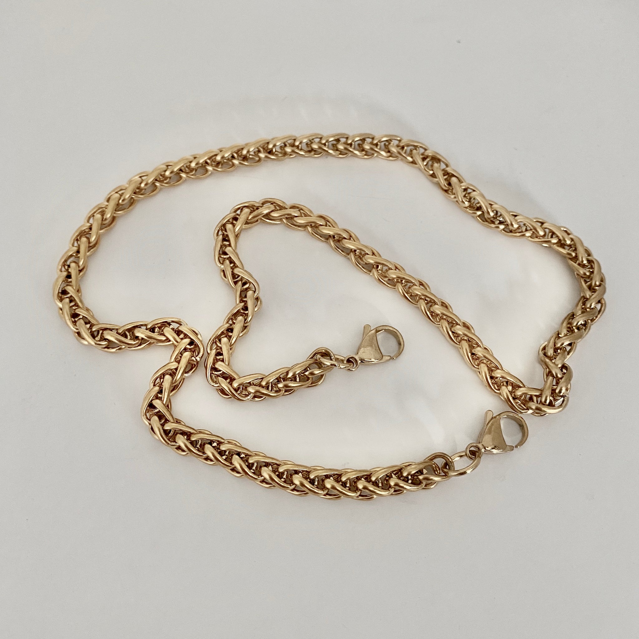 gold over stainless steel mask chain by NYET Jewelry