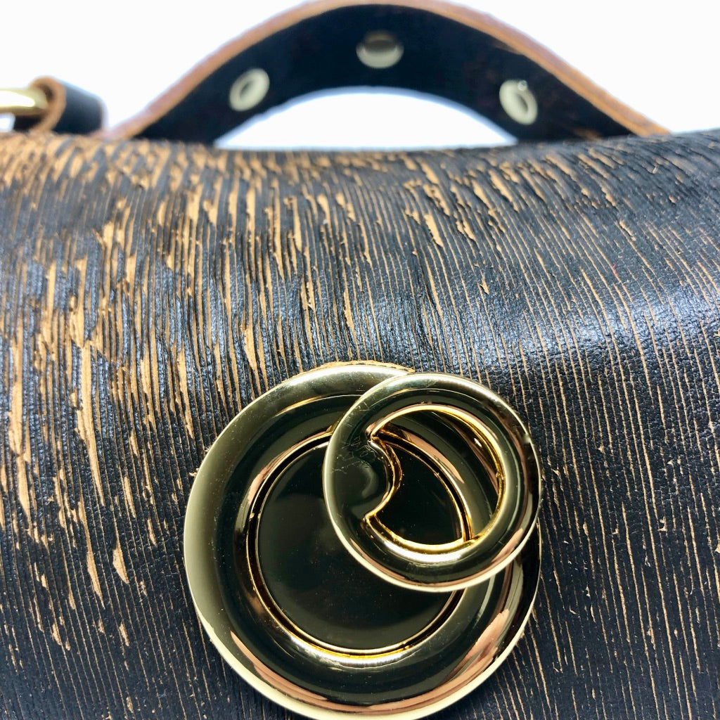 LASER-CUT LEATHER RIVETED EVENING BAG WITH METAL HARDWARE by NYET Jewelry