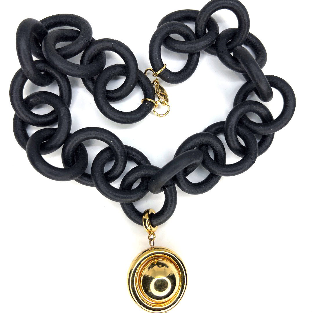 BLACK RUBBER BRACELET WITH SILVER AND GOLD TONE METAL BEADS.by nyet jewelry