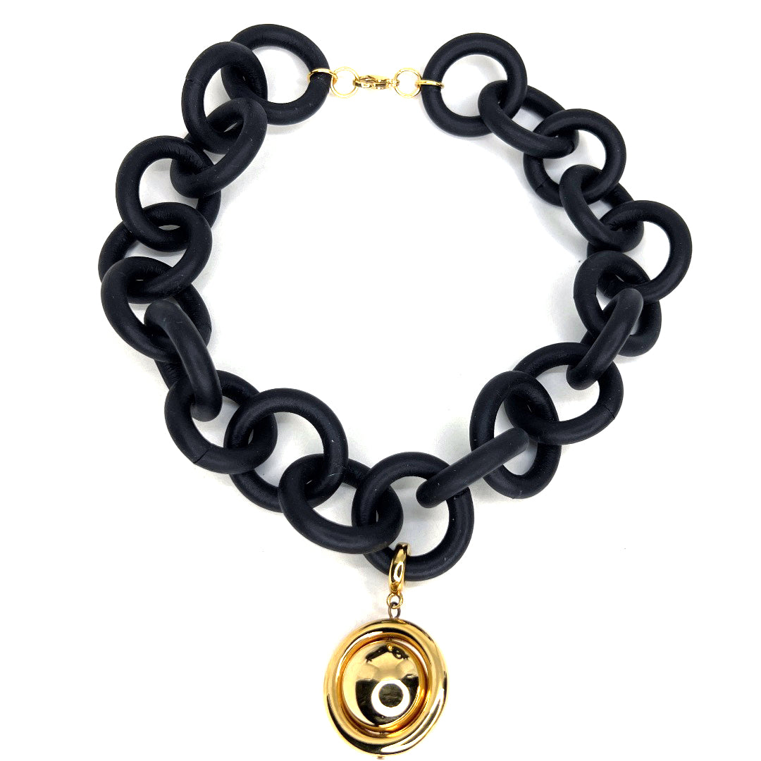 BLACK RUBBER BRACELET WITH SILVER AND GOLD TONE METAL BEADS.by nyet jewelry