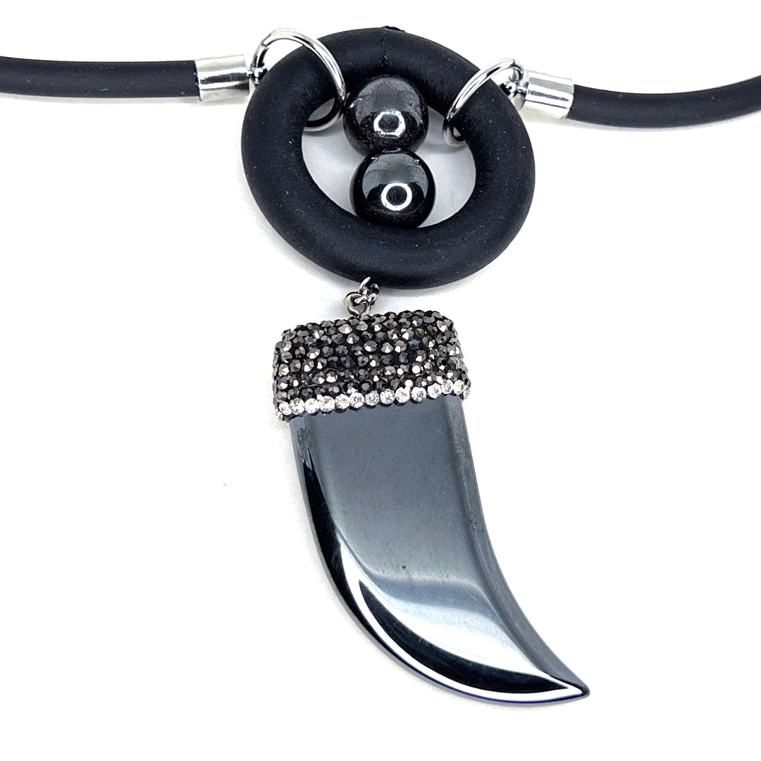 BLACK RUBBER NECKLACE WITH HEMATITE BEADS AND RHINESTONE-PAVE'D HEMATITE PENDANT IN THE SHAPE OF A HORN. by nyet jewelry