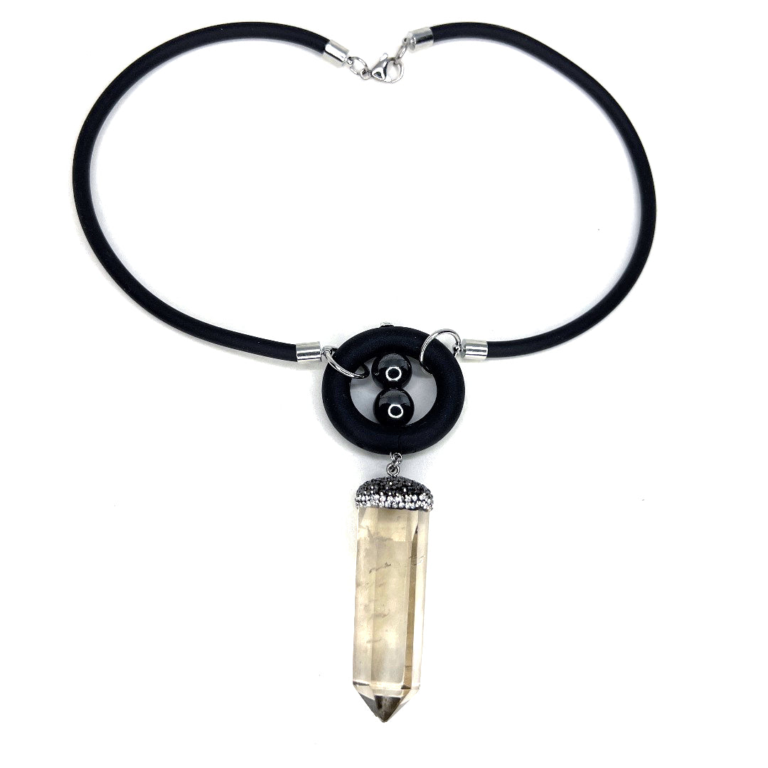 BLACK RUBBER NECKLACE WITH HEMATITE BEADS AND RHINESTONE-PAVE'D POINTED CLEAR QUARTZ PENDANT. by nyet jewelry