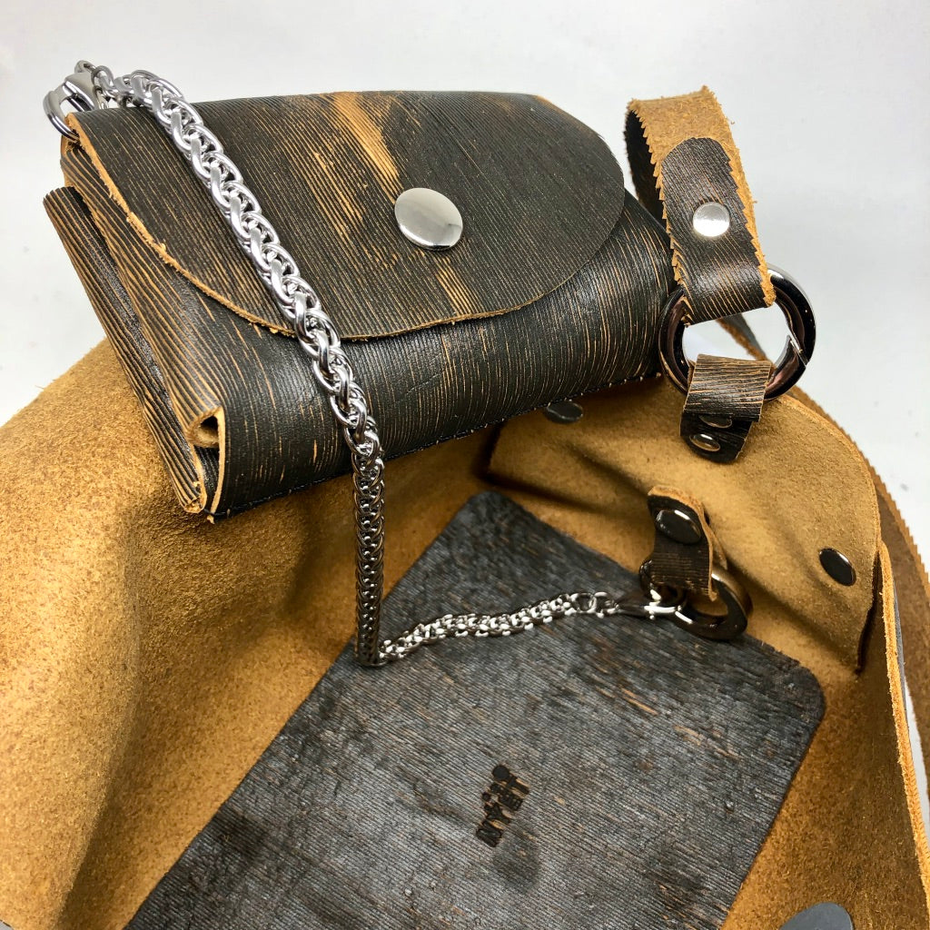 LASER-CUT LEATHER RIVETED EVENING BAG WITH METAL HARDWARE. by NYET Jewelry